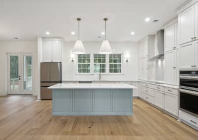 Kitchen island and pendant lights in open kitchen of Doubler floor plan