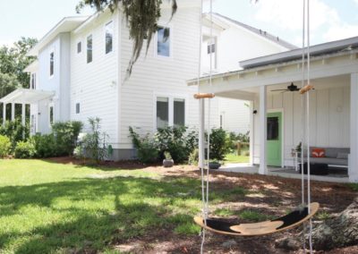 Oak Terrace Preserve home with tree swing in the front yard