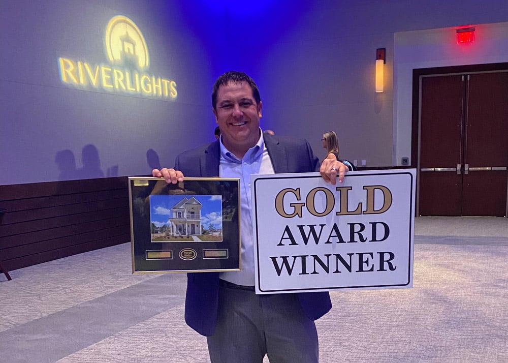 Alan Degen, division president of the Wilmington Division, accepts a Gold Award for the Haywood model home during the 2023 Parade of  Homes.