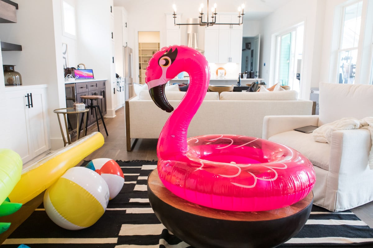 Pool toys in New Leaf living room in Nexton